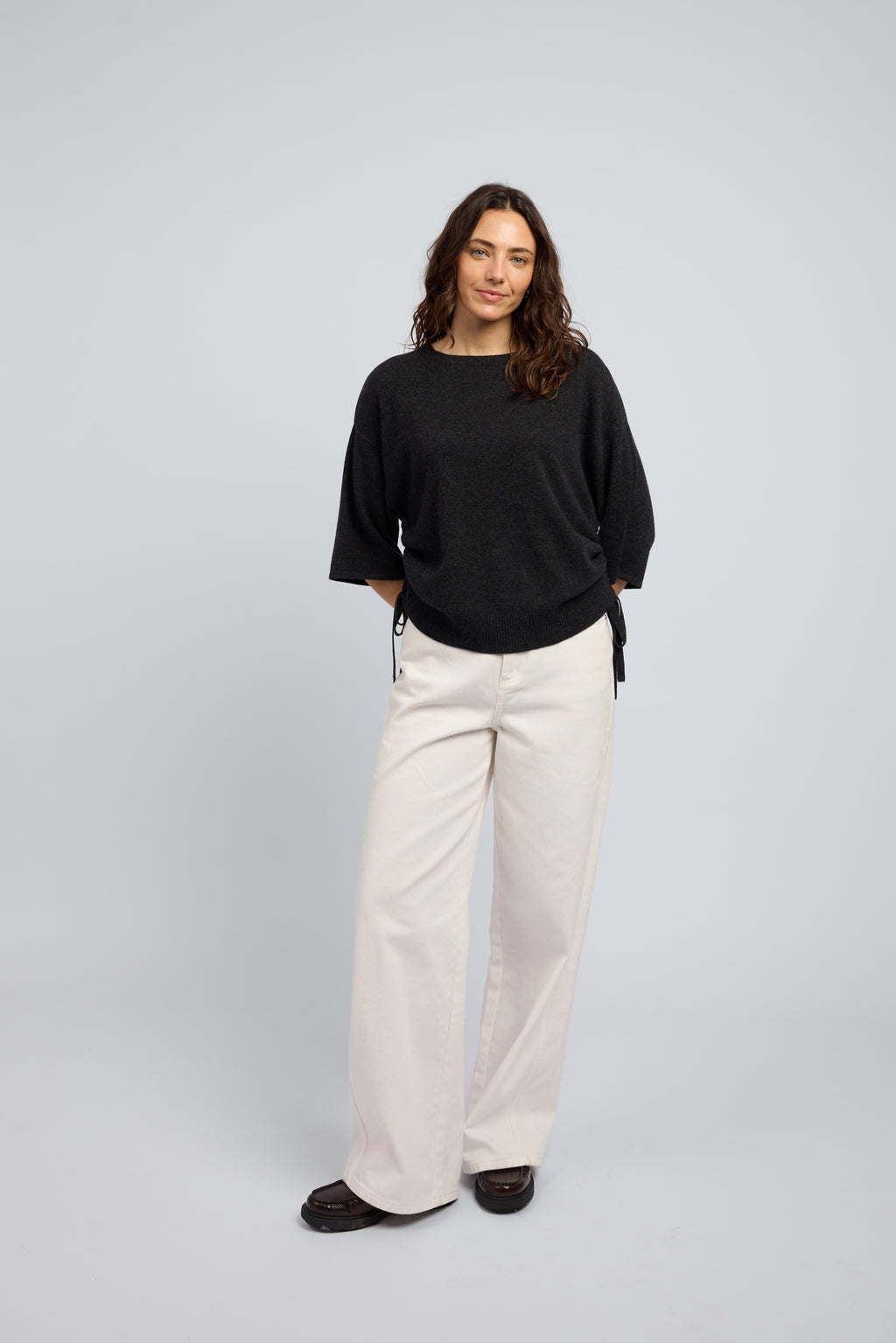 Agnes charcoal cashmere drawstring tee on model front view luxury women’s knitwear